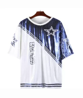 Cowboys are wearing white dresses with blue accents and a blue star graphic trimmed in white.