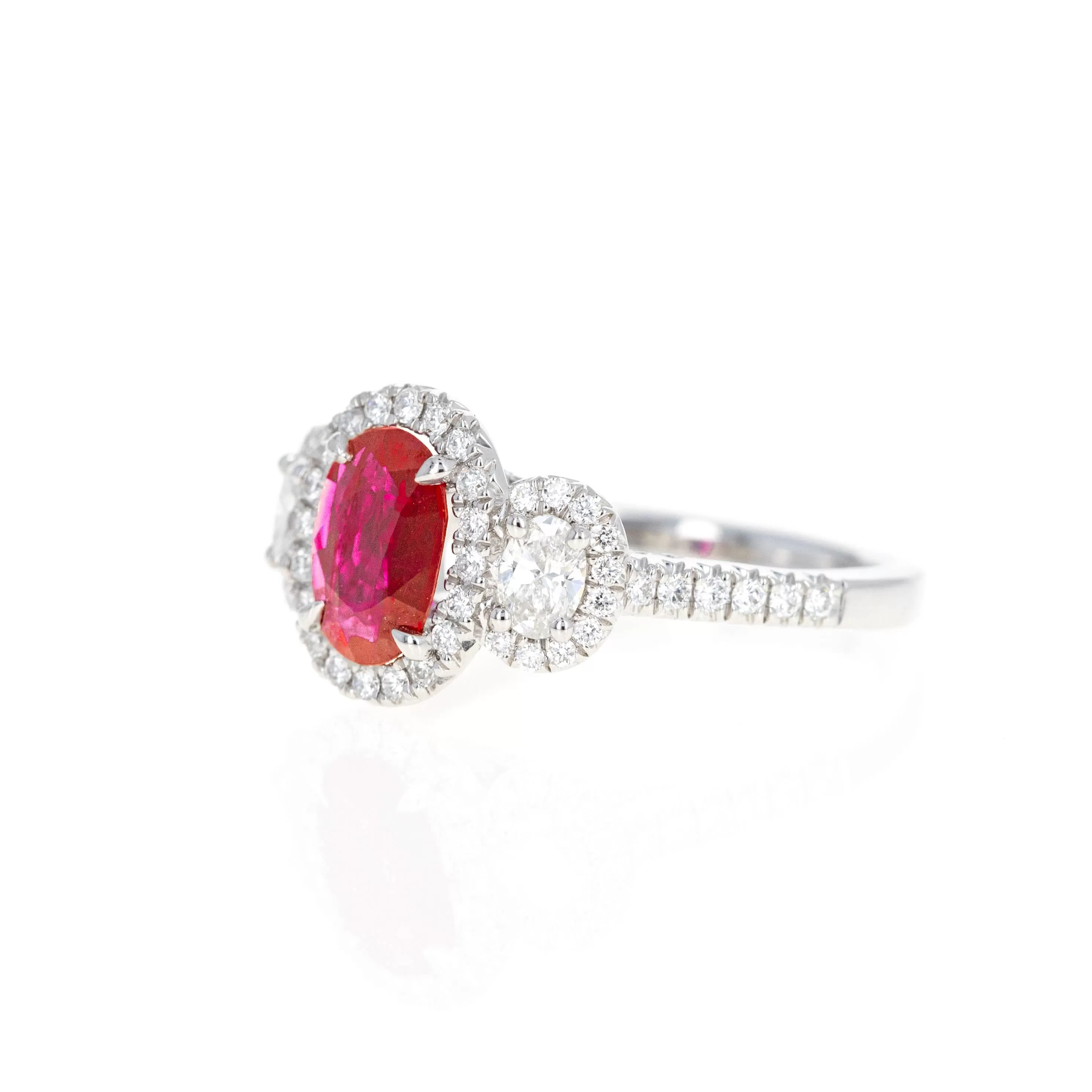 Platinum 0.94 Carat Oval Natural Ruby Diamond Three Stone Halo Ring